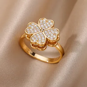 Close-up of 18K gold plated ring with a full zircon-encrusted four-leaf clover design.
