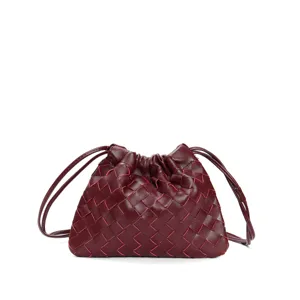 Detailed view of the burgundy woven leather drawstring pouch bag, stylish cloud crossbody accessory.