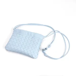 Light blue woven leather crossbody bag stylish dumpling pouch casual shoulder bag for women.