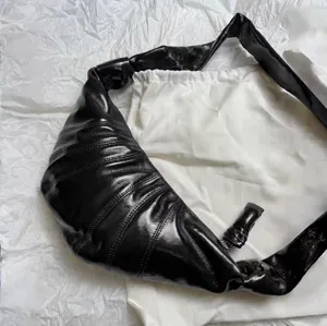 Black glossy croissant crossbody bag stylish knotted strap shoulder dumpling bag for women