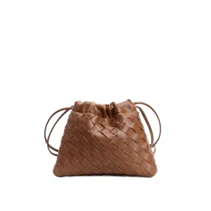 Brown woven leather drawstring shoulder bag, trendy dumpling pouch style for women daily use.