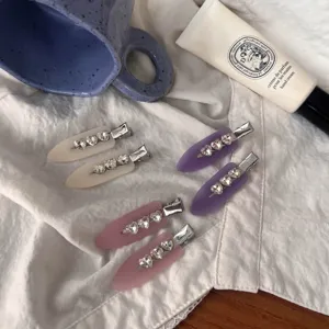 Matte finish hair clips set featuring sparkling heart rhinestones, sweet pastel colors detail view.