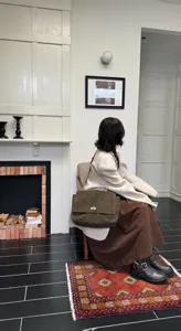 Stylish green suede shoulder bag for women, large capacity flap lock design for commute.