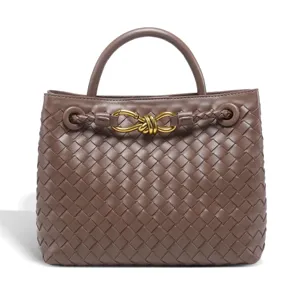 Elegant woven leather top handle handbag with metal knot closure, large capacity retro tote bag.