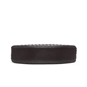 Detailed view of the dark brown woven leather shoulder bag bottom, showing exquisite craft.