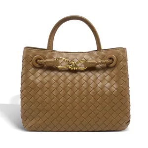 Exquisite woven leather handbag with metal knot detail, vintage top handle tote bag for women.