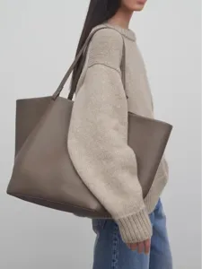 Minimalist genuine leather tote bag for women large capacity commuter shoulder bag daily use.