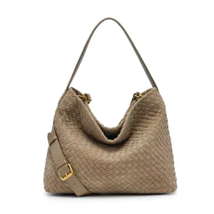 Woven suede shoulder bag for women, slouchy hobo tote with adjustable strap and chic design.