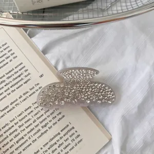 Rhinestone acetate hair claw clip detail, sparkling crystal hair accessory for women.