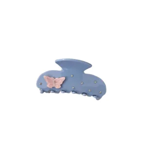 Light blue acetate hair claw clip featuring sweet pink bow and sparkling rhinestones for women.