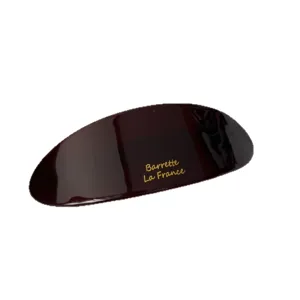 Large dark spring hair clip with glossy finish and elegant golden lettering design.
