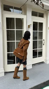 Brown suede crossbody bag for women, large capacity flap shoulder bag with metal lock.