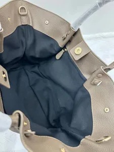 Genuine leather tote bag interior detail, premium cowhide wing bag, fashion women handbag.