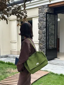 Green suede tote bag for women, large capacity shoulder commuting bag with flap and metal lock.