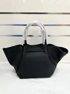 Black leather winged handbag tote bag for women, stylish top handle shoulder crossbody purse.