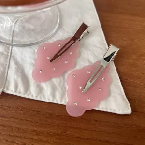 Pink frosted rhinestone hair clips detail shot showing the delicate cloud wing design.