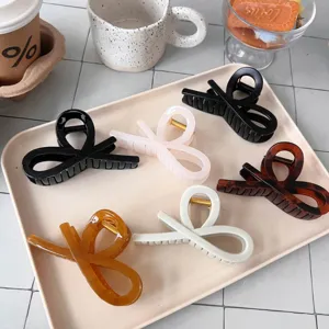 Cross ribbon hair claw clip stylish butterfly design versatile hair accessories daily wear