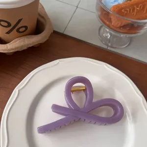 Elegant purple ribbon hair claw clip for women, stylish acrylic daily hair accessory.