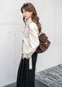 Brown suede shoulder bag for women, large capacity vintage leather commute bag detail view.