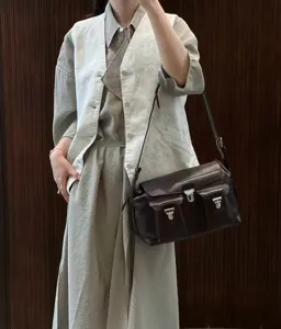 Vintage leather messenger bag for women, stylish brown crossbody shoulder bag with multi pockets.