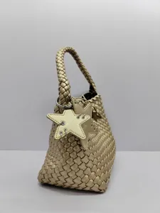 Gold woven shoulder bag with star charm detail, casual daily tote and bucket bag design.