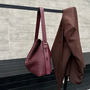 Woven leather shoulder bag for women, large capacity casual underarm tote bag with long strap.