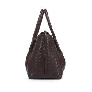 Detailed view of the dark brown leather woven tote bag showing premium craftsmanship and texture.