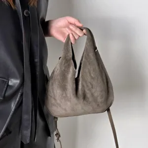 Stylish suede triangular hobo shoulder bag for women, premium genuine leather dumpling handbag.