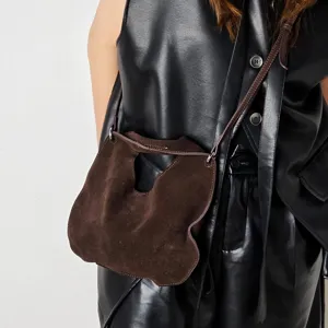 Detailed view of the dark brown suede crossbody dumpling bag, stylish daily accessory.