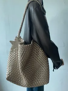 Metallic gold woven tote bag with star charm, large capacity casual shoulder bag for daily use.