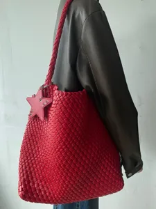 Red woven tote bag for women featuring a star charm, large capacity casual shoulder bag.