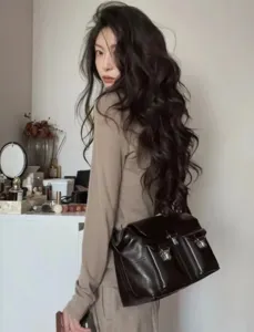 Vintage dark brown leather messenger bag for women, stylish crossbody motorcycle bag.