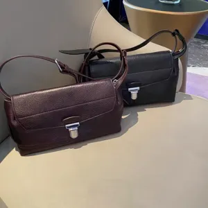 Vintage genuine leather messenger bag with metal lock, chic shoulder crossbody handbag.