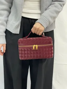 Glossy woven vanity cosmetic bag with top handle and double zipper closure for daily use