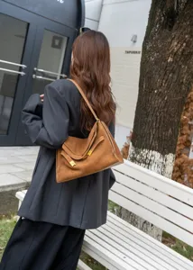 Retro brown suede shoulder bag for women, elegant commuter tote bag with premium leather design.