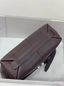 Premium leather messenger bag detail shot, vintage brown cross body bag for women and men.