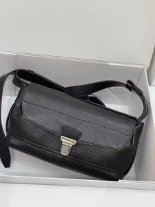 Black leather messenger bag with metal lock, stylish vintage shoulder crossbody bag.