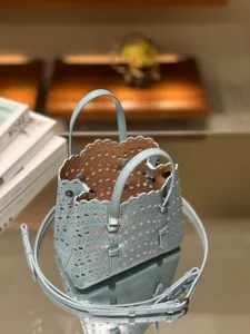 Light blue leather cutout tote bag stylish casual shoulder crossbody handbag for women Chic.