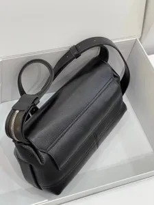 Black genuine leather messenger bag detail shot, vintage shoulder crossbody bag for daily wear.