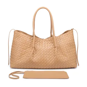 Detailed view of the beige woven leather tote bag featuring classic intrecciato design.