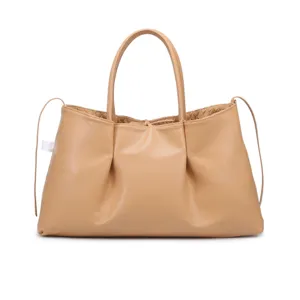 Elegant beige leather tote bag with woven interior details and top handles for women.