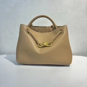 Soft calfskin handbag with metal bow and braided handles for women daily chic fashion style
