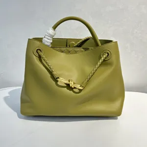 Olive green leather handbag featuring braided handles and elegant gold-tone knot hardware detail.
