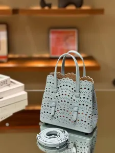 Light blue leather laser-cut tote bag, elegant scalloped edges shoulder handbag for women.