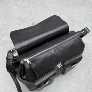 Black genuine leather messenger bag with multi pockets, retro motorcycle crossbody design.