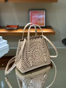 Beige leather laser-cut tote bag, chic french style handbag with shoulder strap for women.