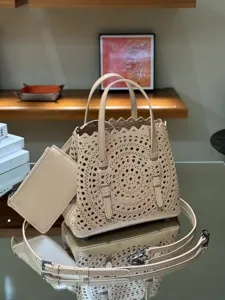 Beige leather laser-cut tote bag with small pouch and strap for women chic daily use