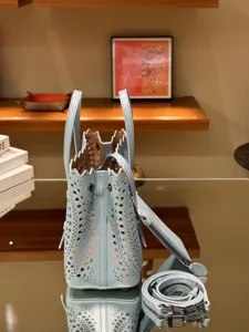 Light blue leather perforated tote bag, stylish french casual shoulder crossbody handbag.