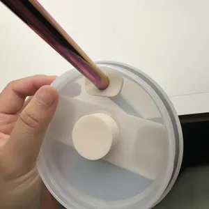Silicone spill stopper and straw cover detail view, compatible with 10mm tumblers.