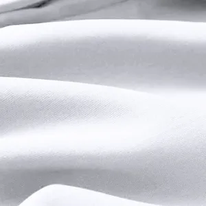 Close-up van de zachte witte stoftextuur detail voor heren casual sportbroek materiaal.